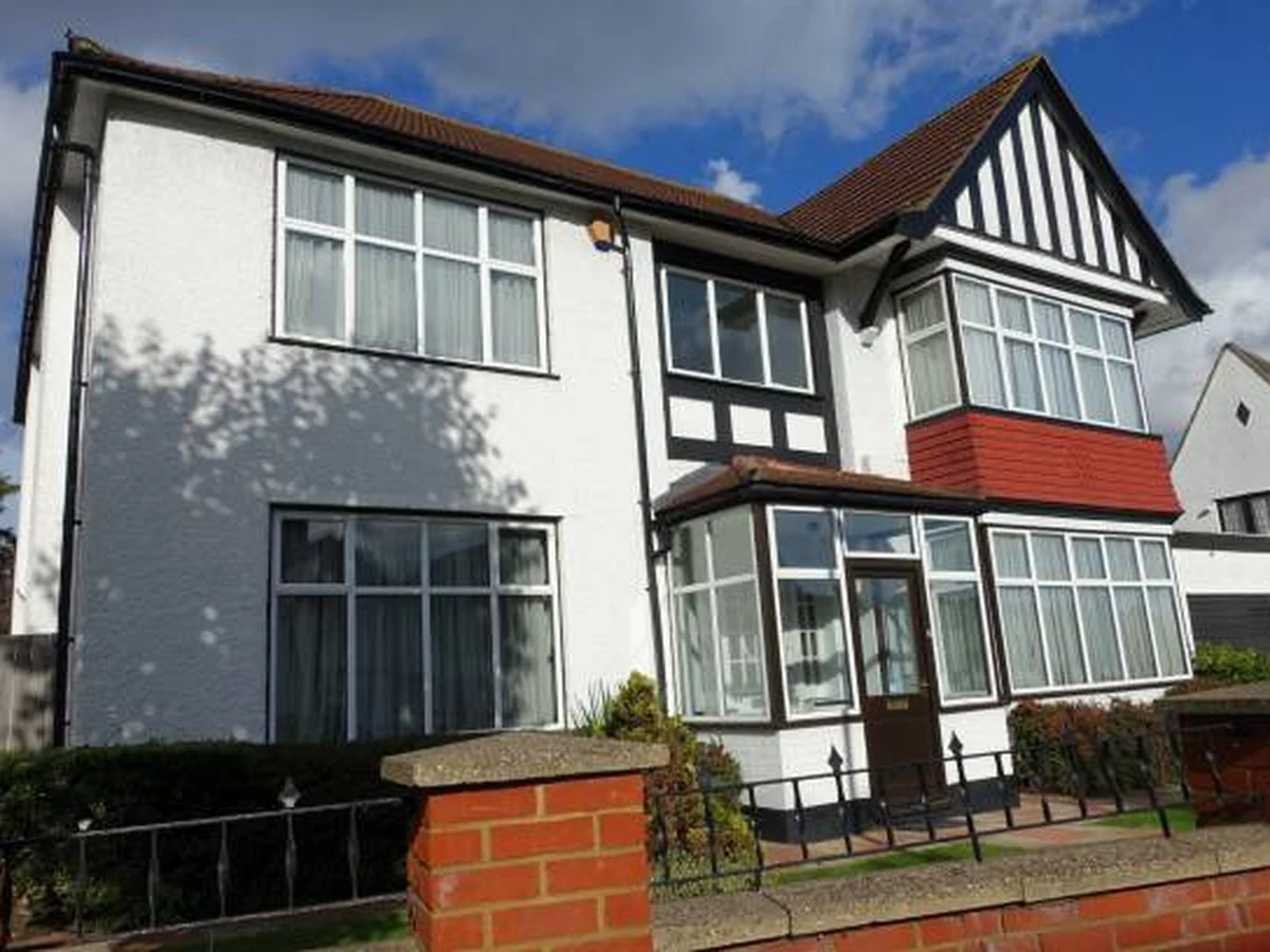 Exterior painting on a 1930s semi-detached house by Cotswolds Decorators in Cirencester