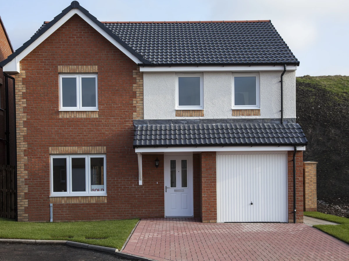 Brick detached house exterior painted by Cotswolds Decorators
