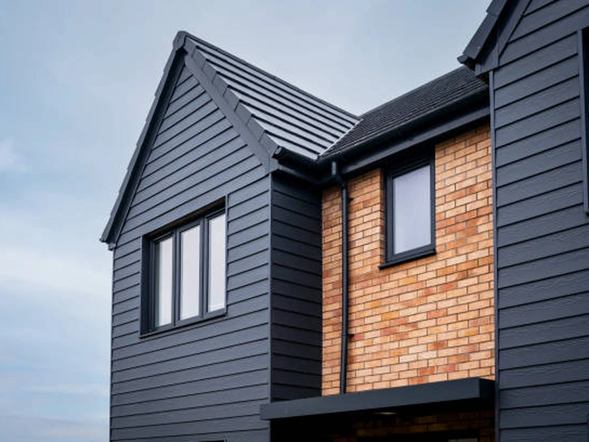 Dark painted exterior of modern house by Cotswolds Decorators