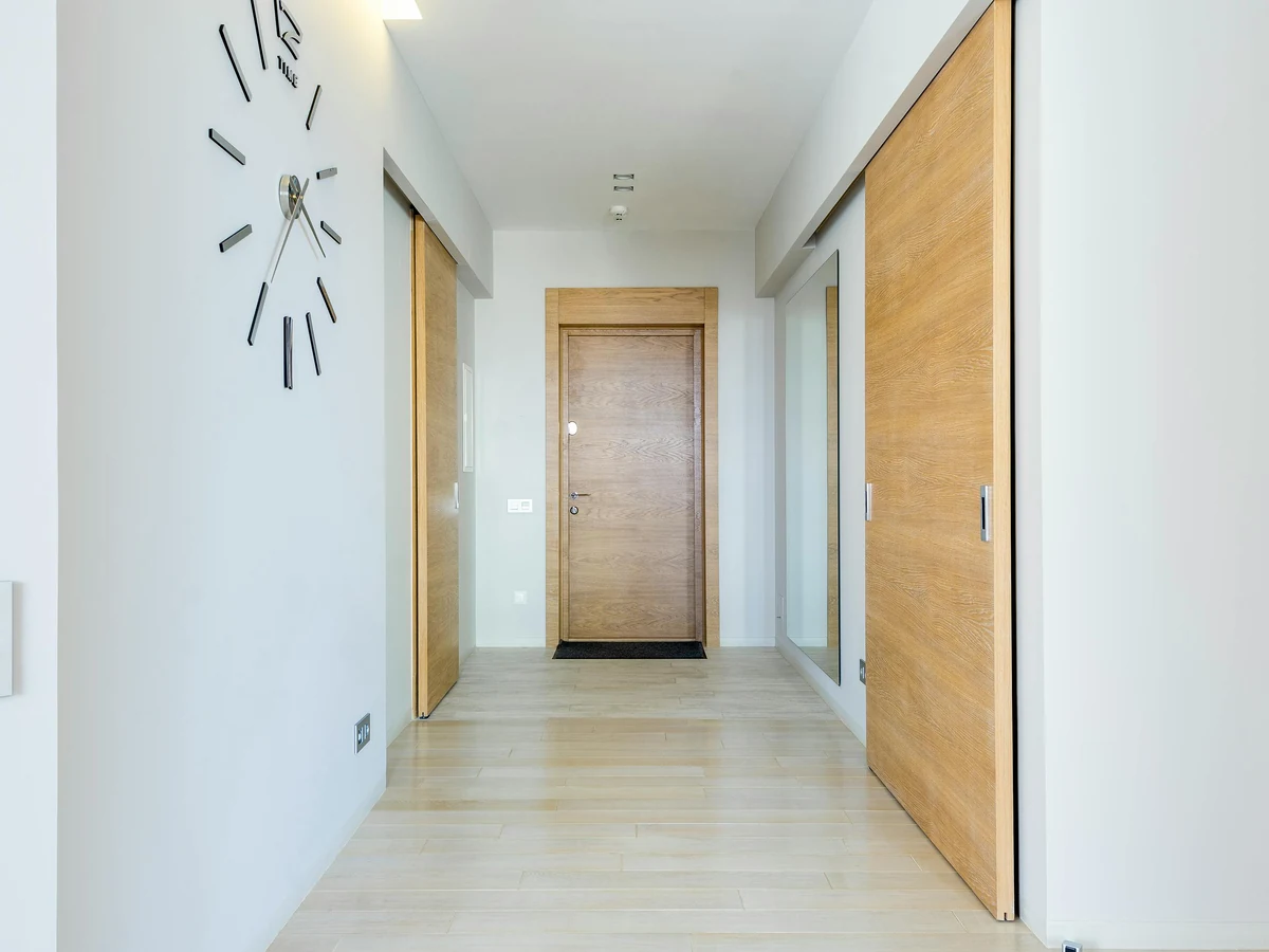 White hallway with painted wood doors and trim by Cotswolds Decorators in the Cotswolds