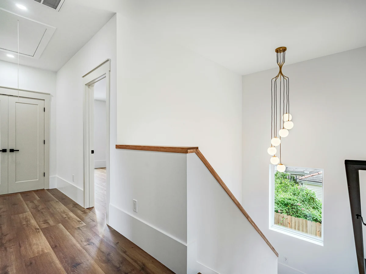 Wall painting in the Cotswolds by Cotswolds Decorators, bright modern landing interior