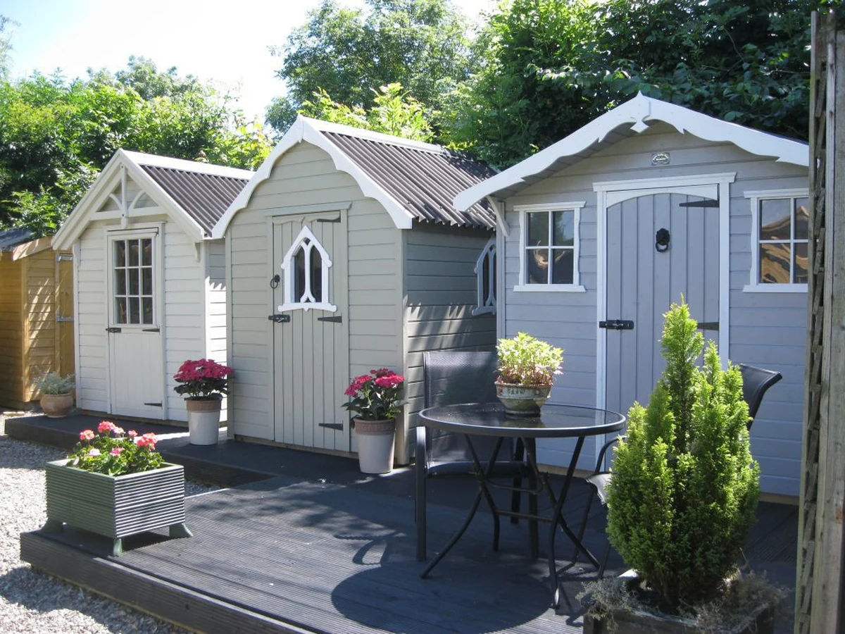 Two garden sheds wood painting in the Cotswolds by Cotswolds Decorators